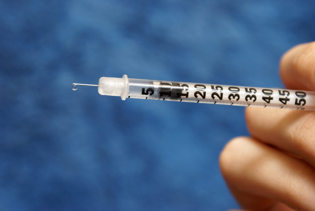 Can You Walk After Stem Cell Injections? 4 close up human hand against blue wall LIV Hospital