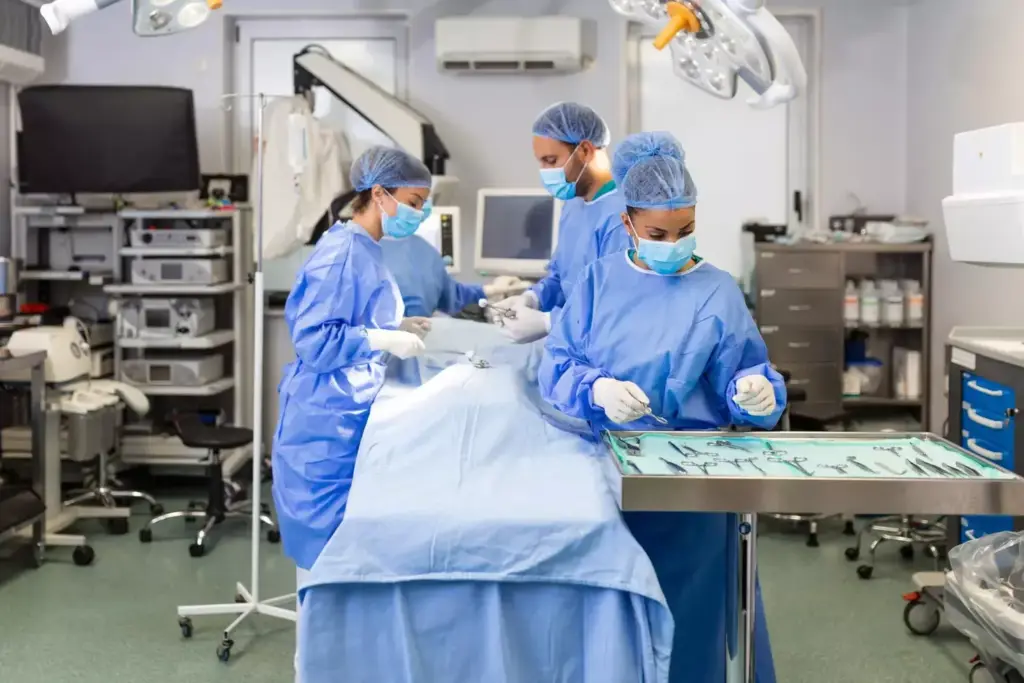 A bustling, well-lit surgical suite, with a team of four medical professionals intensely focused on their collaborative efforts. In the foreground, a surgeon in a crisp white coat carefully manipulates surgical instruments, their movements precise and practiced. Behind them, a scrub nurse assists, passing tools with efficient grace. In the middle ground, an anesthesiologist monitors vital signs on a sleek touchscreen console, brow furrowed in concentration. In the background, a circulating nurse organizes supplies, their actions complementing the team's seamless coordination. Soft, warm lighting illuminates the scene, creating an atmosphere of professionalism and quiet determination as the team works in harmony to ensure a successful outcome. A bustling, well-lit surgical suite, with a team of four medical professionals intensely focused on their collaborative efforts. In the foreground, a surgeon in a crisp white coat carefully manipulates surgical instruments, their movements precise and practiced. Behind them, a scrub nurse assists, passing tools with efficient grace. In the middle ground, an anesthesiologist monitors vital signs on a sleek touchscreen console, brow furrowed in concentration. In the background, a circulating nurse organizes supplies, their actions complementing the team's seamless coordination. Soft, warm lighting illuminates the scene, creating an atmosphere of professionalism and quiet determination as the team works in harmony to ensure a successful outcome.
