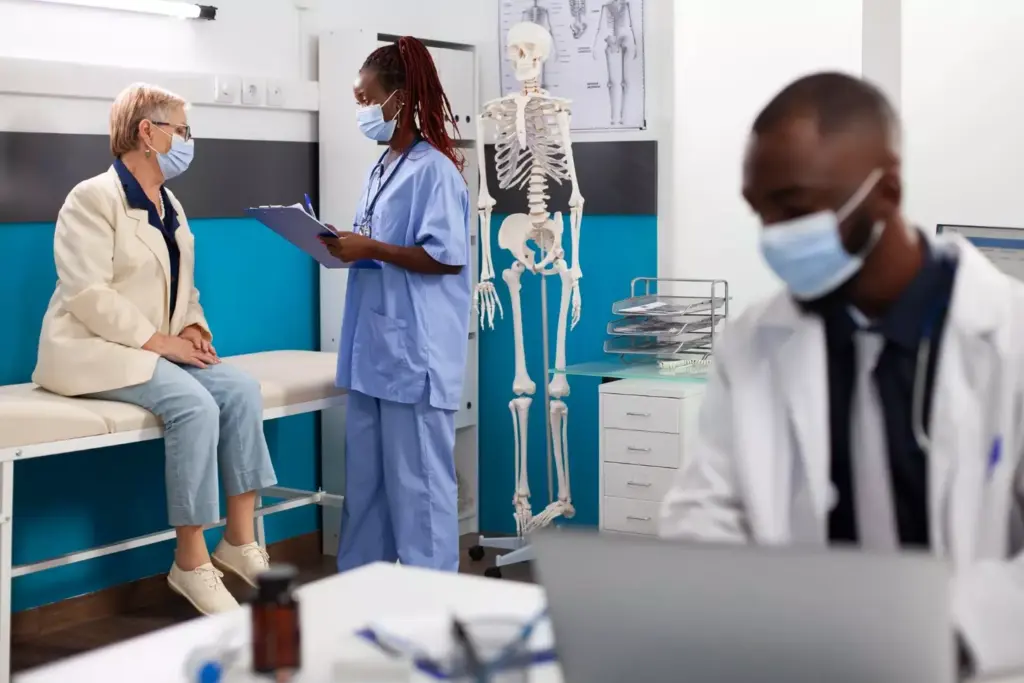 A detailed surgical theater during an ACL reconstruction procedure. In the foreground, the patient's exposed knee joint is surrounded by a team of skilled orthopedic surgeons and nurses, their hands deftly manipulating specialized instruments. Bright surgical lights illuminate the scene, casting a clinical glow. In the middle ground, various medical equipment like arthroscopes, suture materials, and implants are neatly arranged, ready for use. The background shows the sterile environment of the operating room, with clean white walls and floors, conveying a sense of precision and professionalism. The overall atmosphere is one of focused intensity, as the medical team works to meticulously repair the damaged ligament and restore the patient's mobility. A detailed surgical theater during an ACL reconstruction procedure. In the foreground, the patient's exposed knee joint is surrounded by a team of skilled orthopedic surgeons and nurses, their hands deftly manipulating specialized instruments. Bright surgical lights illuminate the scene, casting a clinical glow. In the middle ground, various medical equipment like arthroscopes, suture materials, and implants are neatly arranged, ready for use. The background shows the sterile environment of the operating room, with clean white walls and floors, conveying a sense of precision and professionalism. The overall atmosphere is one of focused intensity, as the medical team works to meticulously repair the damaged ligament and restore the patient's mobility.