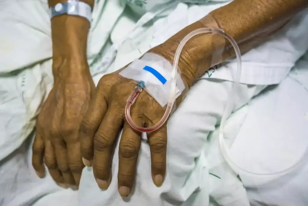 A dimly lit hospital room, the walls painted a calming shade of blue. In the center, a patient rests comfortably, an intravenous line snaking from their arm, delivering life-saving chemotherapy. The infusion pump emits a soft hum, its LED display casting a gentle glow. Nurses, dressed in crisp white uniforms, carefully monitor the treatment, ensuring the delicate balance of medication and fluids. The atmosphere is one of quiet determination, a testament to the critical role of infusion cancer treatment in modern oncology. Soft, diffused lighting illuminates the scene, creating a sense of hope and resilience in the face of a formidable adversary. A dimly lit hospital room, the walls painted a calming shade of blue. In the center, a patient rests comfortably, an intravenous line snaking from their arm, delivering life-saving chemotherapy. The infusion pump emits a soft hum, its LED display casting a gentle glow. Nurses, dressed in crisp white uniforms, carefully monitor the treatment, ensuring the delicate balance of medication and fluids. The atmosphere is one of quiet determination, a testament to the critical role of infusion cancer treatment in modern oncology. Soft, diffused lighting illuminates the scene, creating a sense of hope and resilience in the face of a formidable adversary.
