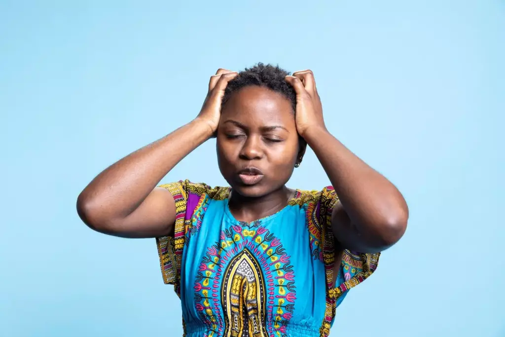 A fatigued person sits slouched in a dimly lit, cluttered room. Their expression is weary, eyes heavy-lidded. Muted colors, soft lighting from a single lamp casts shadows, creating a somber, introspective atmosphere. The figure's posture conveys the physical and mental exhaustion of brain tumor-related fatigue. The background is blurred, hazy, with indistinct shapes suggesting clutter, chaos, and the individual's struggle to focus. A sense of heaviness, malaise, and the burden of the condition permeates the scene. A fatigued person sits slouched in a dimly lit, cluttered room. Their expression is weary, eyes heavy-lidded. Muted colors, soft lighting from a single lamp casts shadows, creating a somber, introspective atmosphere. The figure's posture conveys the physical and mental exhaustion of brain tumor-related fatigue. The background is blurred, hazy, with indistinct shapes suggesting clutter, chaos, and the individual's struggle to focus. A sense of heaviness, malaise, and the burden of the condition permeates the scene.