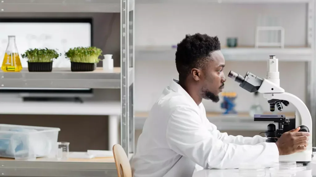 A high-contrast, cinematic image of a CAR T cell clinical trial setting. In the foreground, a researcher in a white lab coat examines vials of cell samples under the bright glow of a microscope. In the middle ground, a team of scientists collaborates around a data-filled computer screen, their faces intently focused. In the background, sleek medical equipment and diagnostic machines lend an air of scientific authority to the scene. Moody lighting casts dramatic shadows, creating a sense of intensity and gravity around the important work being done. The overall atmosphere conveys the cutting-edge, high-stakes nature of these pioneering cancer immunotherapy trials. A high-contrast, cinematic image of a CAR T cell clinical trial setting. In the foreground, a researcher in a white lab coat examines vials of cell samples under the bright glow of a microscope. In the middle ground, a team of scientists collaborates around a data-filled computer screen, their faces intently focused. In the background, sleek medical equipment and diagnostic machines lend an air of scientific authority to the scene. Moody lighting casts dramatic shadows, creating a sense of intensity and gravity around the important work being done. The overall atmosphere conveys the cutting-edge, high-stakes nature of these pioneering cancer immunotherapy trials.