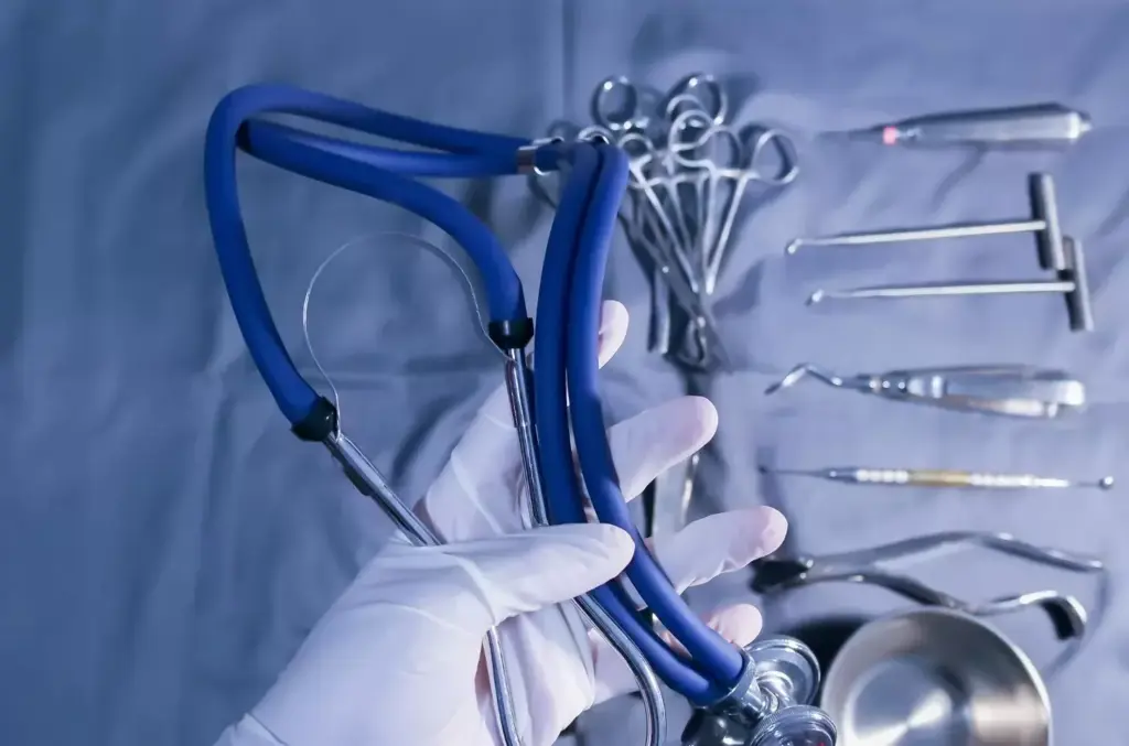 A high-quality, sharply focused image of a selection of modern laparoscopic surgical instruments arranged neatly on a dimly lit metal surface. The instruments include a laparoscope, grasping forceps, scissors, and other essential tools used in minimally invasive procedures. The lighting is dramatic, creating deep shadows and highlights that emphasize the sleek, precise design of the instruments. The composition places the tools in the foreground against a plain, dark background, allowing them to be the sole focus of the image. The overall mood is one of clinical professionalism and technological advancement, reflecting the evolution of laparoscopic techniques. A high-quality, sharply focused image of a selection of modern laparoscopic surgical instruments arranged neatly on a dimly lit metal surface. The instruments include a laparoscope, grasping forceps, scissors, and other essential tools used in minimally invasive procedures. The lighting is dramatic, creating deep shadows and highlights that emphasize the sleek, precise design of the instruments. The composition places the tools in the foreground against a plain, dark background, allowing them to be the sole focus of the image. The overall mood is one of clinical professionalism and technological advancement, reflecting the evolution of laparoscopic techniques.