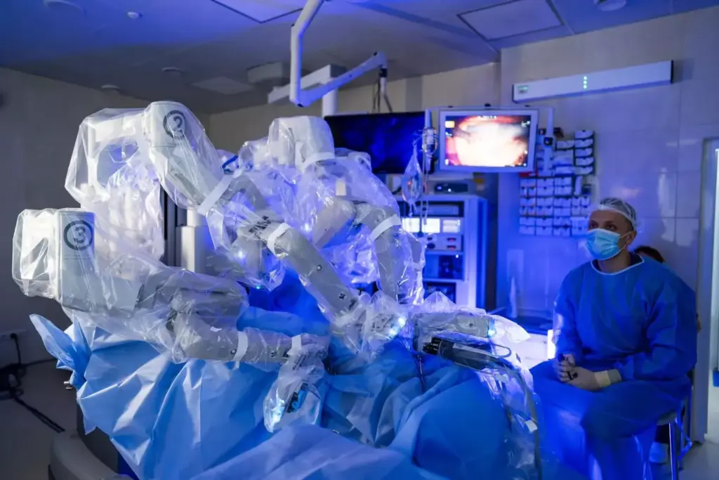 A highly advanced surgical suite, bathed in a warm, clinical glow. At the center, a cutting-edge robotic arm, its articulated limbs poised with precision. Surrounding it, a symphony of state-of-the-art monitors, displaying real-time data and intricate 3D models of the patient's anatomy. In the foreground, a team of skilled surgeons, their movements synchronized with the robotic assistant, performing a delicate, minimally invasive procedure with unparalleled accuracy. The atmosphere is one of quiet focus and technological mastery, a glimpse into the future of modern medicine. A highly advanced surgical suite, bathed in a warm, clinical glow. At the center, a cutting-edge robotic arm, its articulated limbs poised with precision. Surrounding it, a symphony of state-of-the-art monitors, displaying real-time data and intricate 3D models of the patient's anatomy. In the foreground, a team of skilled surgeons, their movements synchronized with the robotic assistant, performing a delicate, minimally invasive procedure with unparalleled accuracy. The atmosphere is one of quiet focus and technological mastery, a glimpse into the future of modern medicine.