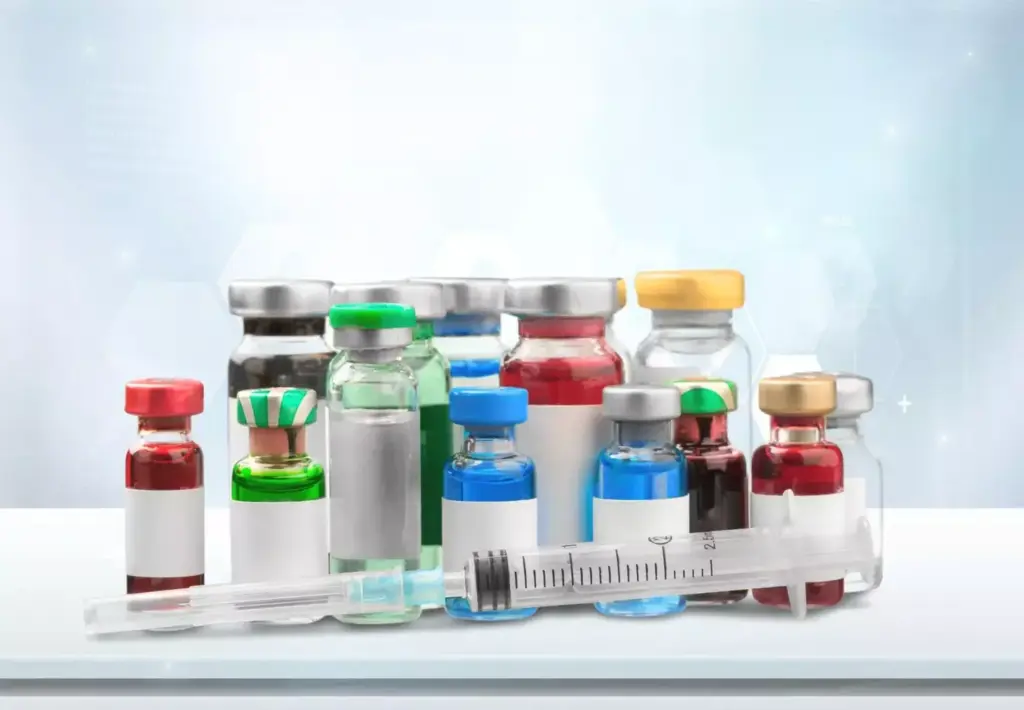 A laboratory counter with an array of pharmaceuticals and medical equipment. In the foreground, a collection of various pill bottles, syringes, and vials of medication, artfully arranged. The middle ground features a stack of medical journals and a computer monitor displaying molecular structures and drug information. The background is softly lit, with a subtle depth of field, conveying a sense of scientific precision and medical expertise. The overall composition suggests the comprehensive nature of myocardial infarction treatments, with a focus on the essential drugs used in this context. A laboratory counter with an array of pharmaceuticals and medical equipment. In the foreground, a collection of various pill bottles, syringes, and vials of medication, artfully arranged. The middle ground features a stack of medical journals and a computer monitor displaying molecular structures and drug information. The background is softly lit, with a subtle depth of field, conveying a sense of scientific precision and medical expertise. The overall composition suggests the comprehensive nature of myocardial infarction treatments, with a focus on the essential drugs used in this context.