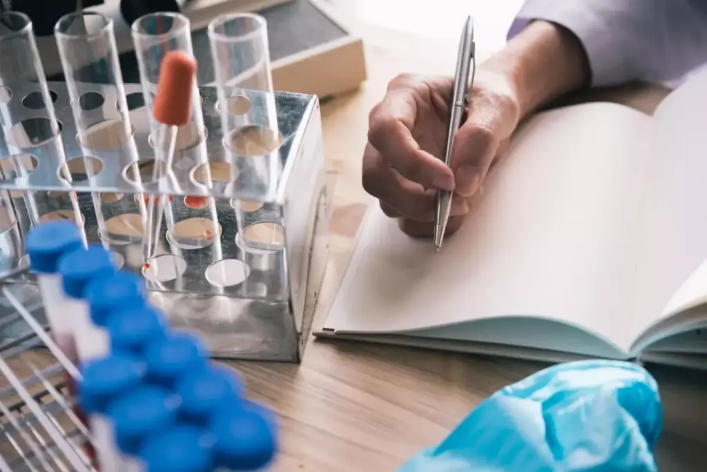 A meticulously-detailed journal cover, featuring a closeup of medical research documents, laboratory glassware, and scientific instruments. The foreground showcases an open notebook with handwritten notes, a pen, and a petri dish. The middle ground displays a stethoscope, a microscope, and vials filled with liquid samples. The background is a softly-lit, clinical environment with a subtle grid pattern suggestive of data visualization. Warm lighting casts a contemplative, scholarly ambiance, highlighting the serious yet innovative nature of breast cancer research and treatment. The overall composition conveys the intellectual rigor and medical significance of the journal's content. A meticulously-detailed journal cover, featuring a closeup of medical research documents, laboratory glassware, and scientific instruments. The foreground showcases an open notebook with handwritten notes, a pen, and a petri dish. The middle ground displays a stethoscope, a microscope, and vials filled with liquid samples. The background is a softly-lit, clinical environment with a subtle grid pattern suggestive of data visualization. Warm lighting casts a contemplative, scholarly ambiance, highlighting the serious yet innovative nature of breast cancer research and treatment. The overall composition conveys the intellectual rigor and medical significance of the journal's content.