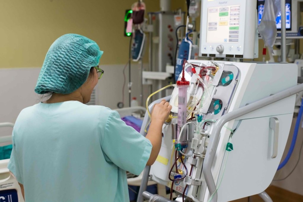 a patient's blood is being extracted and processed through an apheresis machine a patient's blood is being extracted and processed through an apheresis machine