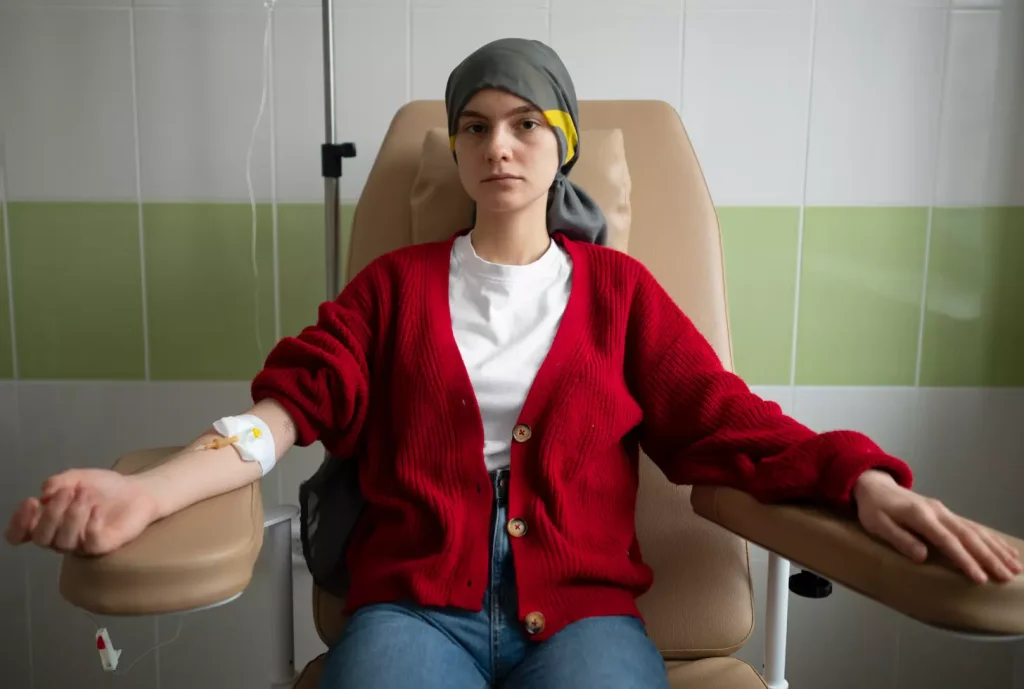 a weary-looking cancer patient sitting with an expression of concern, a weary-looking cancer patient sitting with an expression of concern,