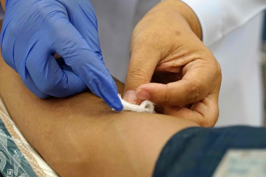 dermatologist's hands performing a basal cell carcinoma removal procedure dermatologist's hands performing a basal cell carcinoma removal procedure