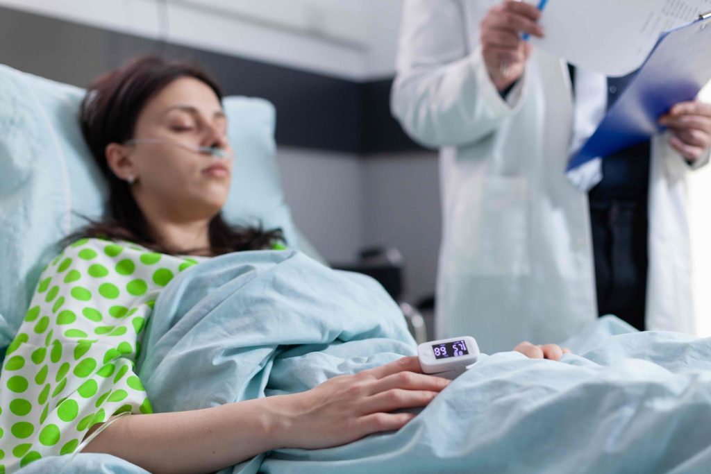 patient lying on a hospital bed, undergoing the stem cell harvesting procedure patient lying on a hospital bed, undergoing the stem cell harvesting procedure