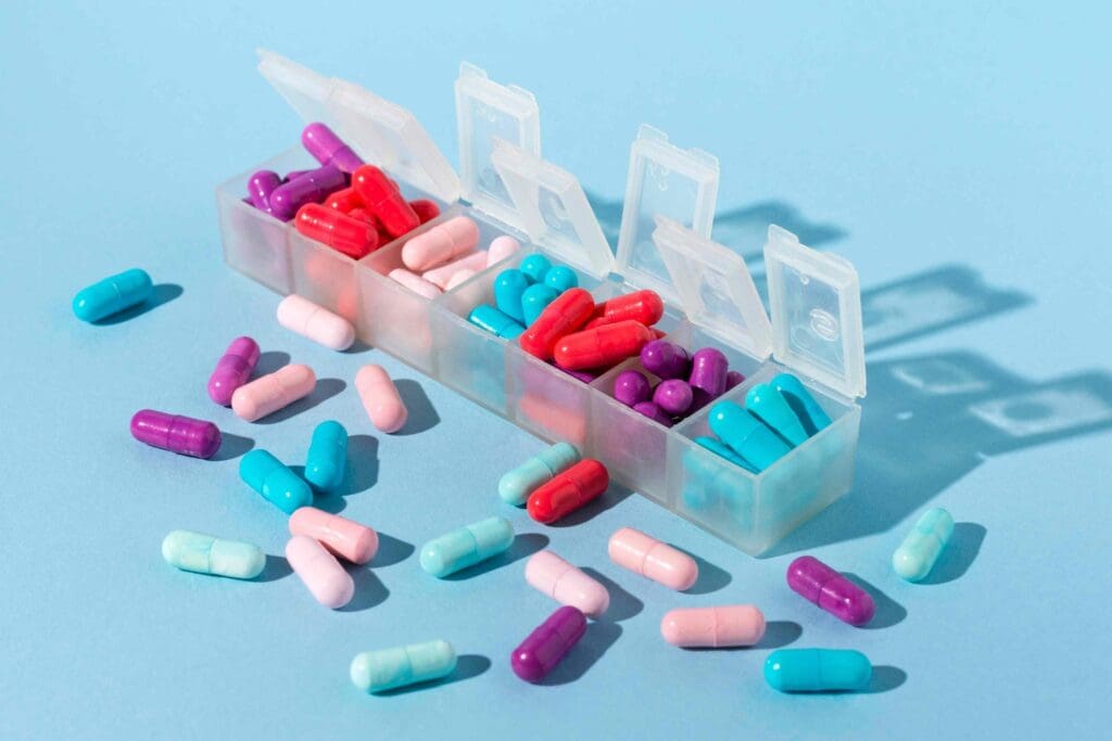 various pharmaceutical pills and capsules in an organized arrangement
